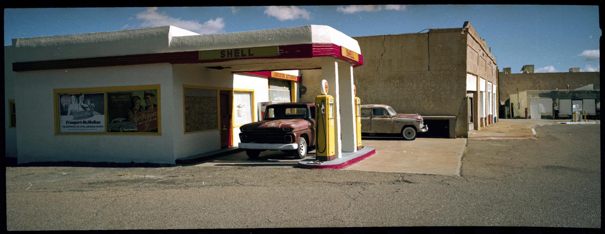 An old-fashioned gas station stands at Erie Street in Bisbee, Ariz., Oct. 26, 2021. Erie Street is what remains of Lowell, a small town incorporated into Bisbee in the early 1900s. The Adams family lived on a lonely dirt road about 8 miles from the center of Bisbee, an old copper-mining town in southeastern Arizona known today for its antique shops and laid-back attitudes. (AP Photo/Dario Lopez-Mills)