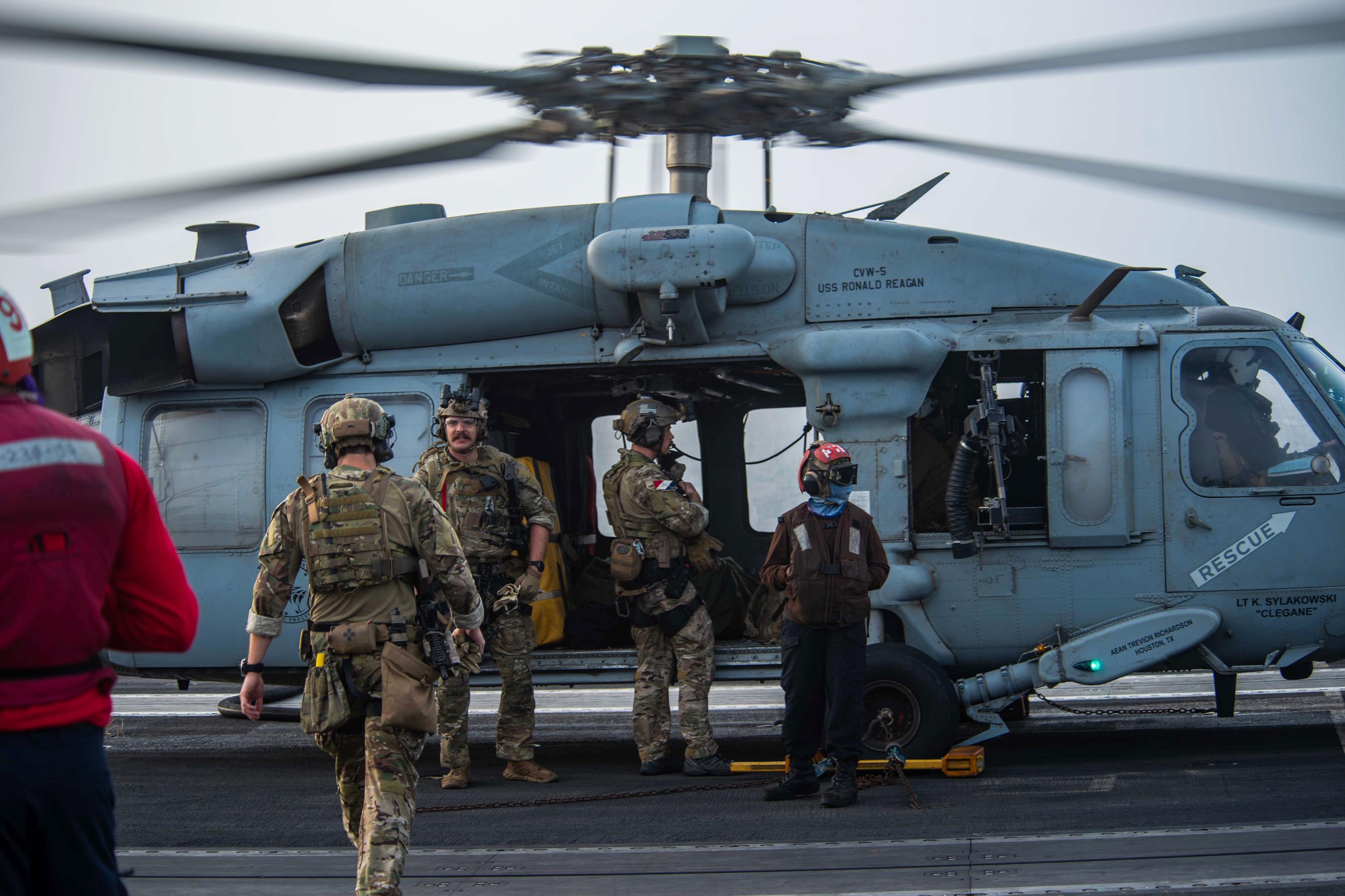 US Navy says drone strike hit oil tanker off Oman, killing 2 - Associated Press
