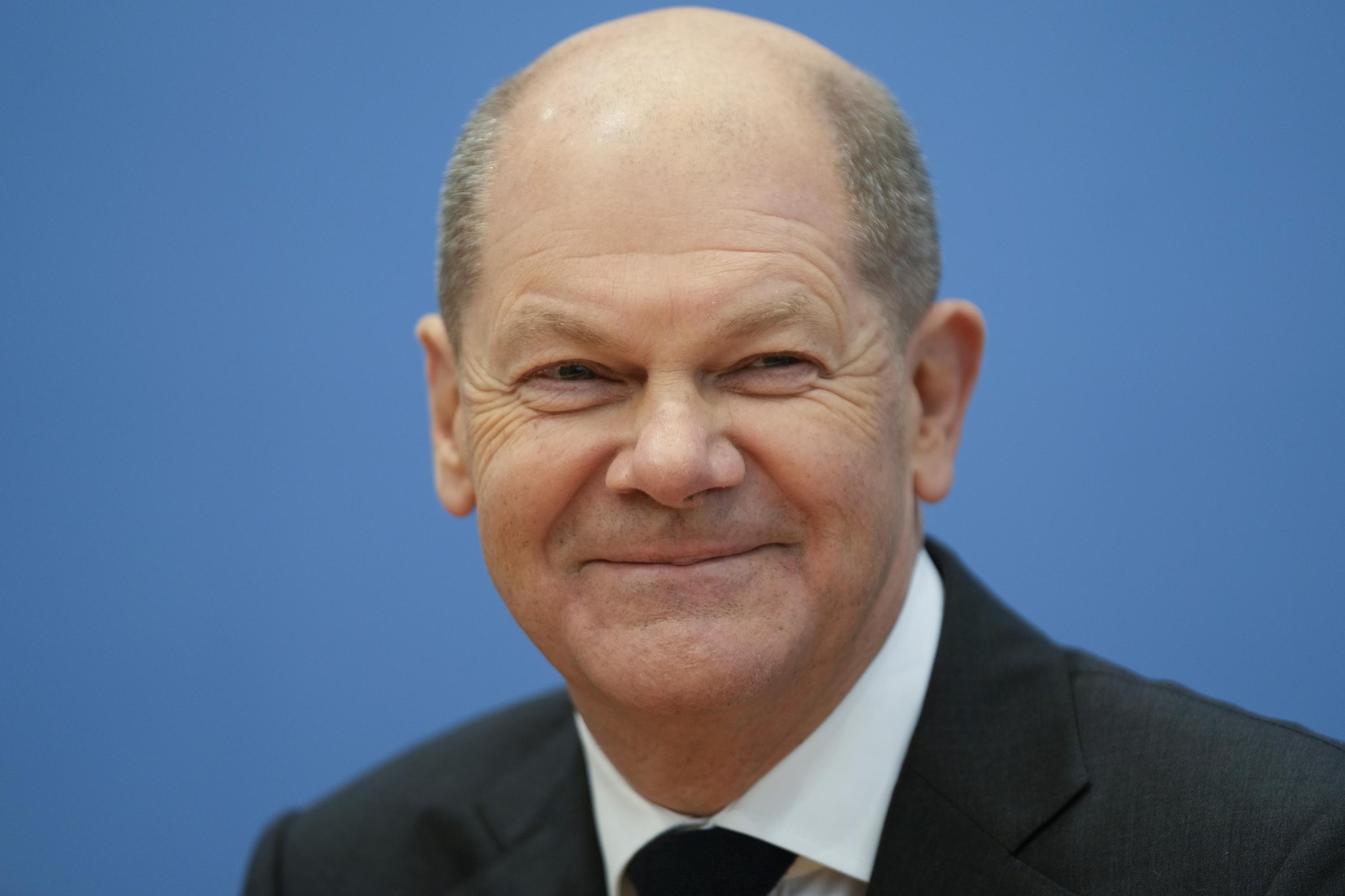 Scholz succeeds Merkel as German chancellor, opening new era