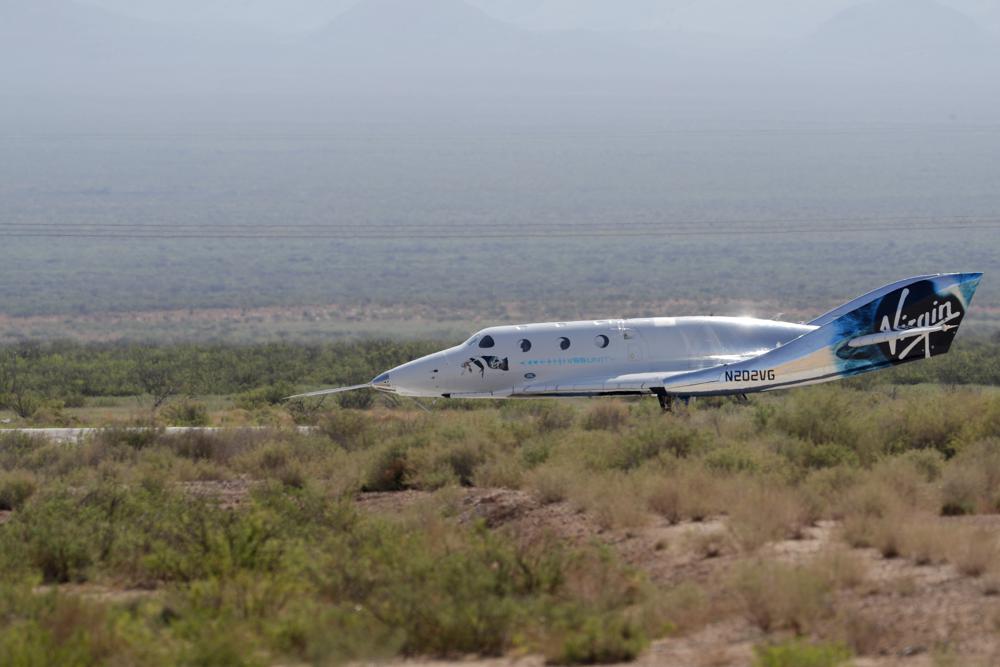 The Virgin Galactic rocket plane, with founder Richard Branson and other crew members on board, lands back in Spaceport America near Truth or Consequences, N.M., Sunday, July 11, 2021. (AP Photo/Andres Leighton)