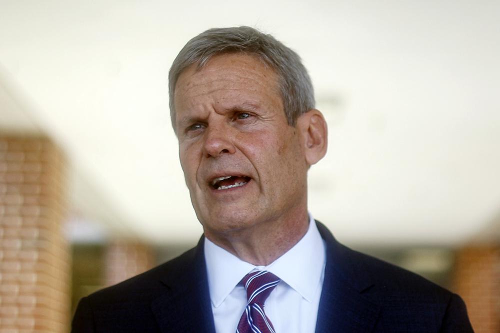 FILE - Tennessee Gov. Bill Lee speaks to local media at the front of McConnell Elementary School on Aug. 11, 2021 in Hixson, Tenn. Emails obtained by The Associated Press show that Lee’s office warned top legislative staffers that a bill limiting public health measures during the COVID pandemic would violate federal law. They passed it anyway and the Republican governor signed it into law even though his legislative counsel warned that Tennessee risks losing federal funding for violating the Americans with Disabilities Act. (Troy Stolt/Chattanooga Times Free Press via AP, File)