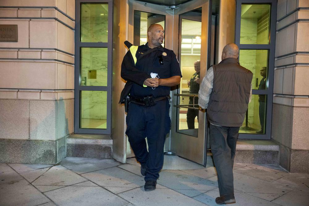 U.S. Capitol Police Sgt. Harry Dunn leaves federal court following a verdict in the Rhodes trial in Washington, Tuesday, Nov. 29, 2022. Oath Keepers founder Stewart Rhodes was convicted Tuesday of seditious conspiracy for a violent plot to overturn Democrat Joe Biden's presidential win, handing the Justice Department a major victory in its massive prosecution of the Jan. 6, 2021, insurrection. (AP Photo/Andrew Harnik)