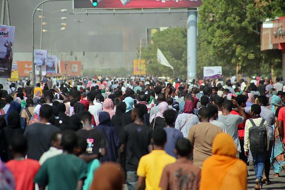 Thousands of pro-democracy protesters take to the streets to condemn a takeover by military officials in Khartoum, Sudan, Monday Oct. 25, 2021. Sudan’s military seized power Monday, dissolving the transitional government hours after troops arrested the acting prime minister and other officials. The takeover comes more than two years after protesters forced the ouster of longtime autocrat Omar al-Bashir and just weeks before the military was expected to hand the leadership of the council that runs the African country over to civilians. (AP Photo/Ashraf Idris)