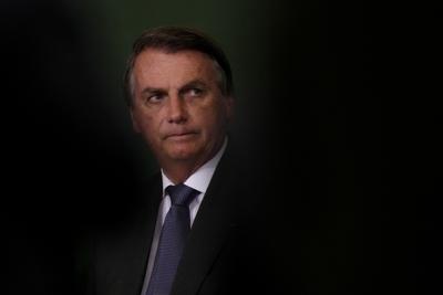 ARCHIVO -  En esta foto de archiivo del 25 de octubre de 2021, el presidente brasleño Jair Bolsonaro asiste al lanzamiento del Programa Nacional de Crecimiento Verde en el palacio presidencial de Planalto en Brasilia. (AP Foto/Eraldo Peres, File)