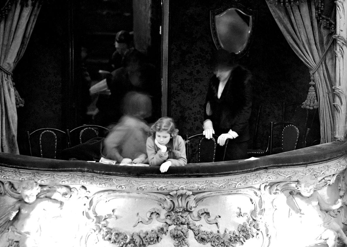 Princess Elizabeth is seen in the Duchess's box at the "Dick Whittington" pantomime at the Lyceum Theater, Feb. 6, 1935. Princess Elizabeth and her little sister Princess Margaret Rose went with their mother Elizabeth, the Duchess of York, to the pantomime. (AP Photo)