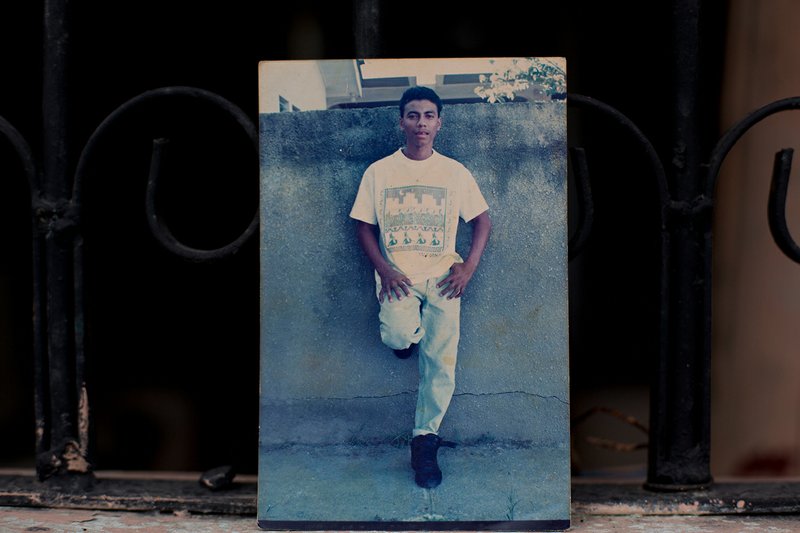 This Oct. 31, 2018 photo shows an undated family photo of Wilmer Gerardo Nunez as a young adult, at his mother's home in the Ciudad Planeta neighborhood of San Pedro Sula, Honduras. Eight years ago, at the age of 35, Nunez left Honduras for the United States, only to disappear in Mexico, leaving his anguished mother in limbo. (AP Photo/Moises Castillo)