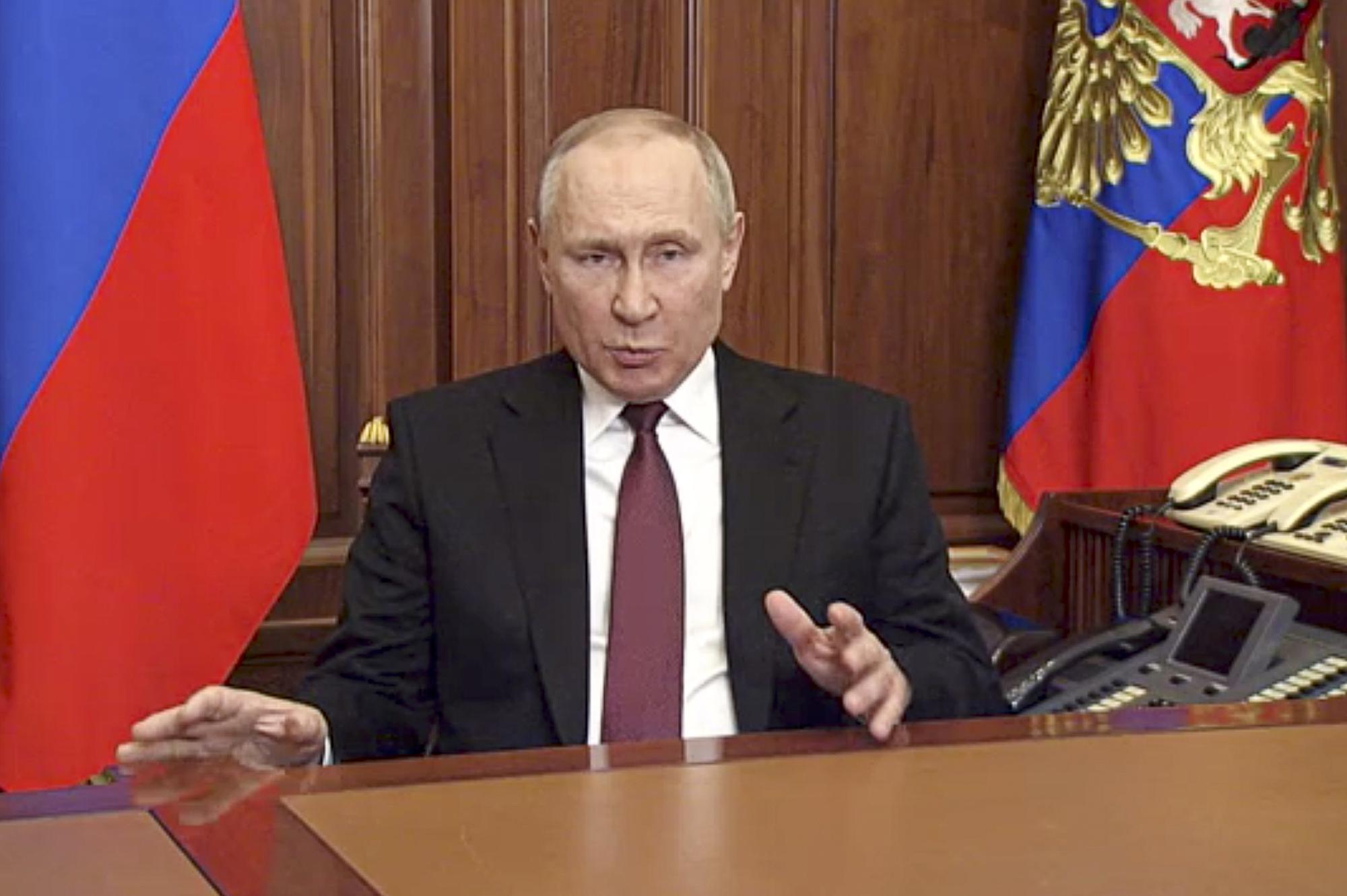 FILE - In this image made from video released by the Russian Presidential Press Service, Russian President Vladimir Putin addressees the nation in Moscow, Russia, Thursday, Feb. 24, 2022. Russian troops launched their anticipated attack on Ukraine on Thursday, as Putin cast aside international condemnation and sanctions and warned other countries that any attempt to interfere would lead to "consequences you have never seen." (Russian Presidential Press Service via AP, File)