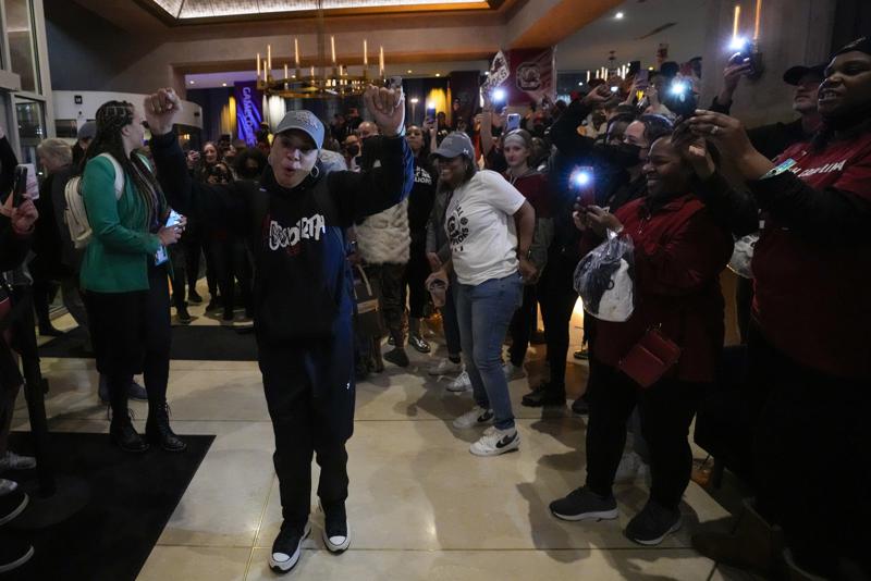 South Carolina head coach Dawn Staley greets fans as the team returns to the team's hotel following Women's Final Four NCAA basketball tournament, Sunday, April 3, 2022, in Minneapolis. South Carolina defeated UConn earlier in the night to win the national championship. (AP Photo/Charlie Neibergall)