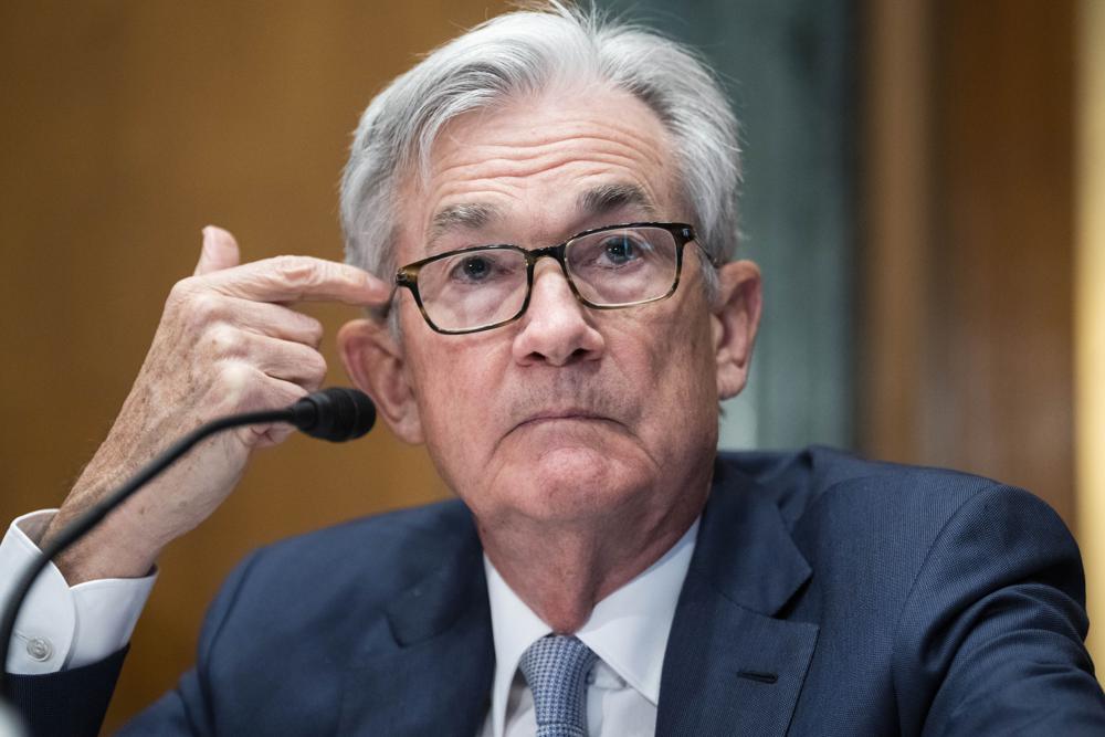 FILE - Federal Reserve Chairman Jerome Powell testifies before the Senate Banking Committee hearing, March 3, 2022 on Capitol Hill in Washington. The Federal Reserve is poised this week to begin unleashing its most drastic steps in three decades to attack inflation by making it costlier to borrow — for a car, a home, a business deal, a credit card purchase — all of which will compound Americans' financial strains and likely weaken the economy. The Fed is expected to announce Wednesday, May 3, 2022 that it will begin quickly shrinking its vast stockpile of Treasury and mortgage bonds beginning in June — a move that will have the effect of further tightening credit. (Tom Williams, Pool via AP, File)