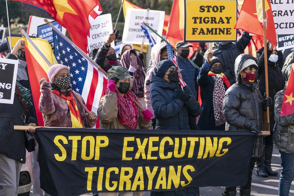 FILE - A group from the Tigrayan diaspora in North America protest about the conflict in Ethiopia, near the State Department, on Dec. 22, 2021, in Washington. Officials in Ethiopia have arbitrarily detained and forcibly disappeared thousands of ethnic Tigrayans who recently were deported from Saudi Arabia, a new Human Rights Watch report said Wednesday, Jan. 5, 2022, as the country's deadly Tigray conflict continues. (AP Photo/Alex Brandon, File)