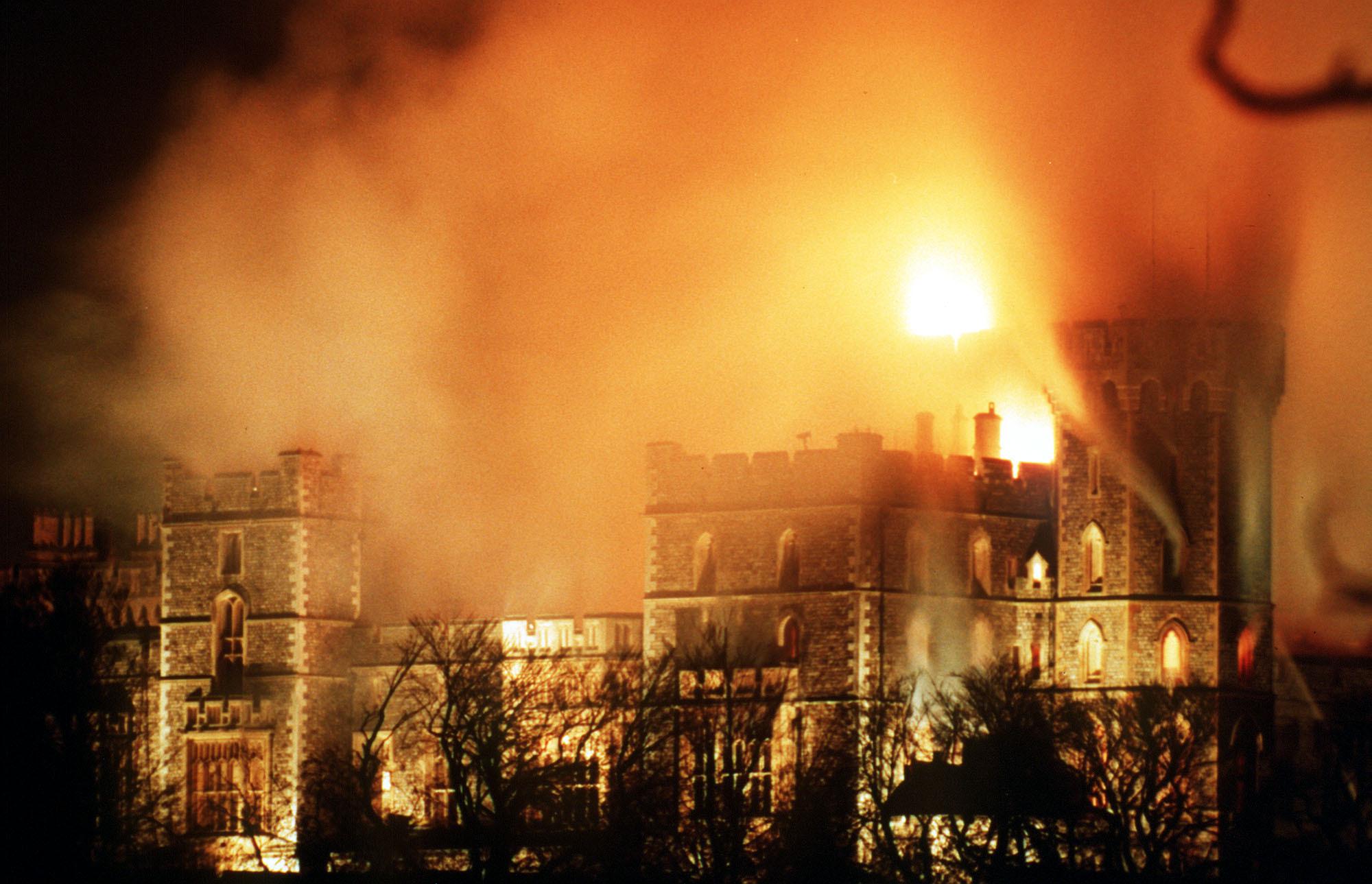 FILE - A view of Windsor Castle after a major fire, causing millions of pounds of damage, in Windsor, England. Nov. 20, 1992.Queen Elizabeth II, Britain’s longest-reigning monarch and a rock of stability across much of a turbulent century, has died. She was 96. Buckingham Palace made the announcement in a statement on Thursday Sept. 8, 2022. (AP Photo/Denis Paquin, File)