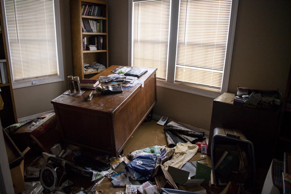 The office of the Rhodes family is in disarray after their home flooded following heavy rainfall on Saturday, Aug. 21, 2021, in Dickson, Tenn. (Josie Norris/The Tennessean via AP)
