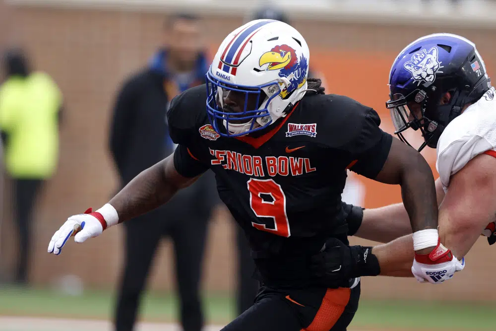 National defensive lineman Lonnie Phelps Jr of Kansas runs drills during practice for the Senior Bowl NCAA college football game Thursday, Feb. 2, 2023, in Mobile, Ala.. (AP Photo/Butch Dill)