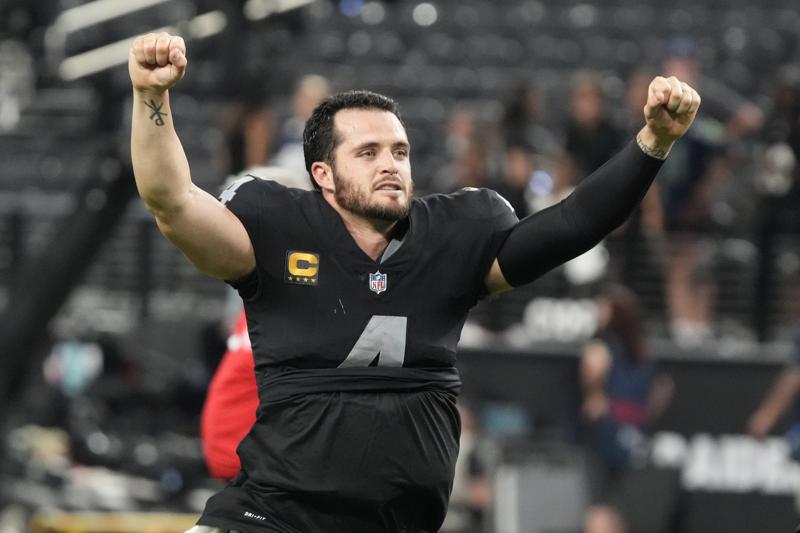 Las Vegas Raiders quarterback Derek Carr (4) celebrates after defeating the Baltimore Ravens in overtime in an NFL football game, Monday, Sept. 13, 2021, in Las Vegas. (AP Photo/Rick Scuteri)