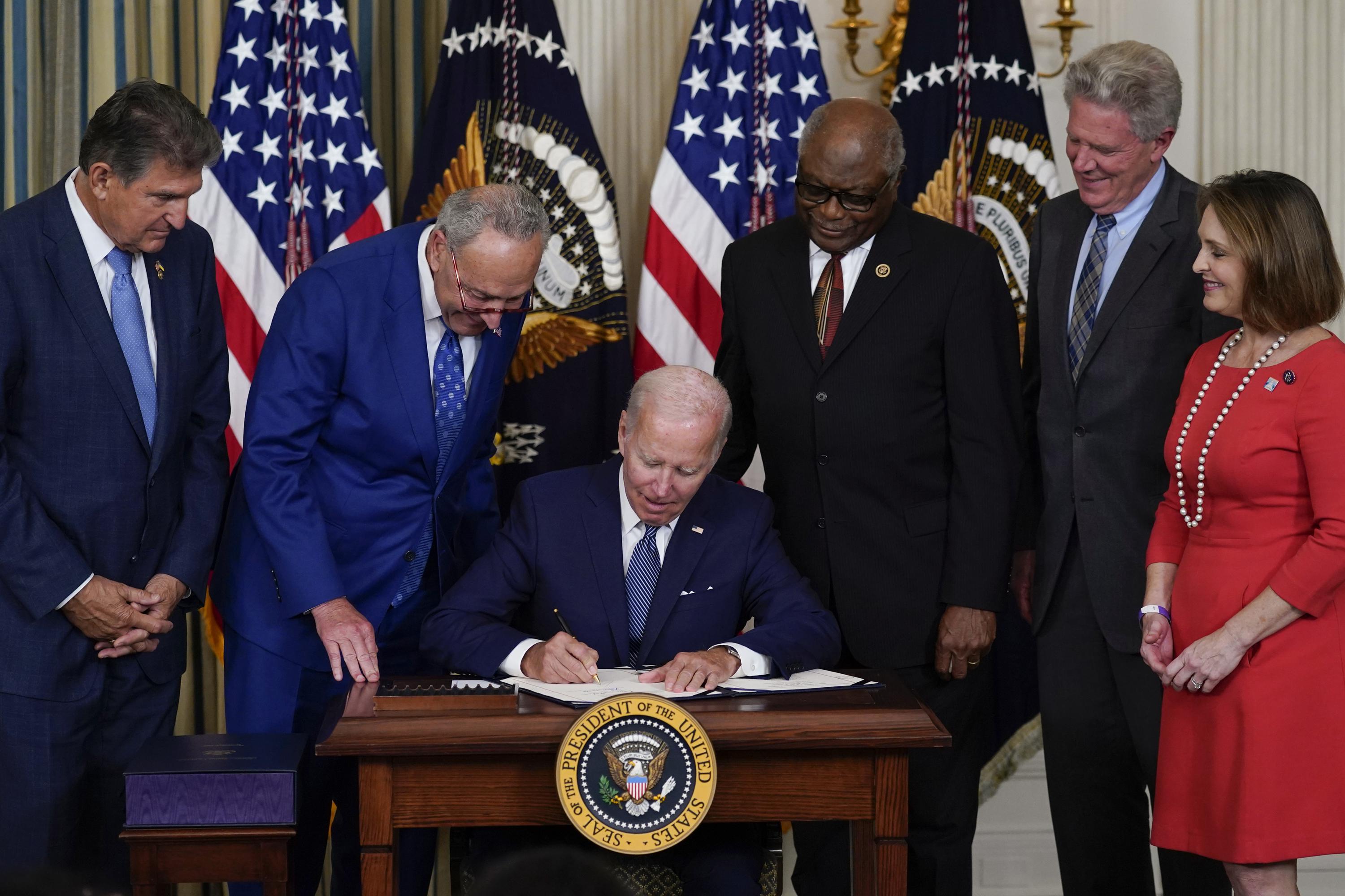 Biden signs massive climate and health care legislation | AP News