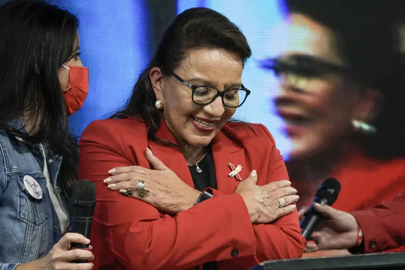 FILE - Free Party presidential candidate Xiomara Castro acknowledges her supporters after general elections, in Tegucigalpa, Honduras, Nov. 28, 2021. Castro announced on Tuesday, March 14, 2023, that Honduras under her administration is opening diplomatic relations with the People´s Republic of China. (AP Photo/Moises Castillo, File)
