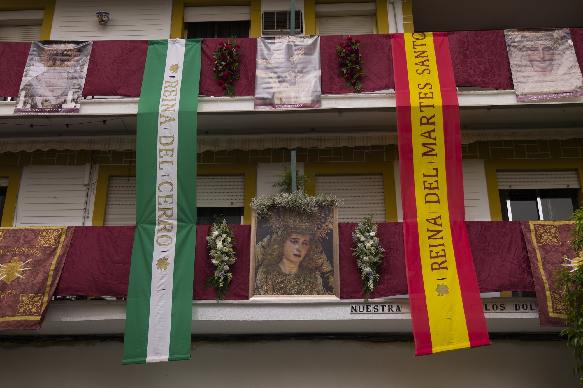 Balconies decorated with Catholic religious banners during the Holy Week in Seville. (Credit: Laura Leon/AP.)