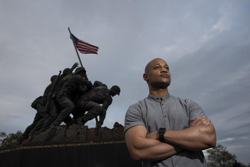 Reserve Marine Maj. Tyrone Collier visits the U.S. Marine Corps War Memorial near his home in Arlington, Va., on Saturday, April 17, 2021. When Collier was a newly minted second lieutenant and judge advocate, he recalls a salute to him from a Black enlisted Marine. But even after Collier acknowledged the gesture, the salute continued. Puzzled, Collier asked why the Marine held it for so long. “He said, ‘Sir, I just have to come clean with something. ... We never see Black officers. We never see people like you and it makes me extraordinarily proud,’” Collier recalls. (AP Photo/Cliff Owen)