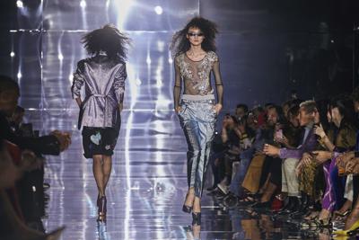 Tom Ford closes Fashion Week with big hair, miles of sparkle | AP News