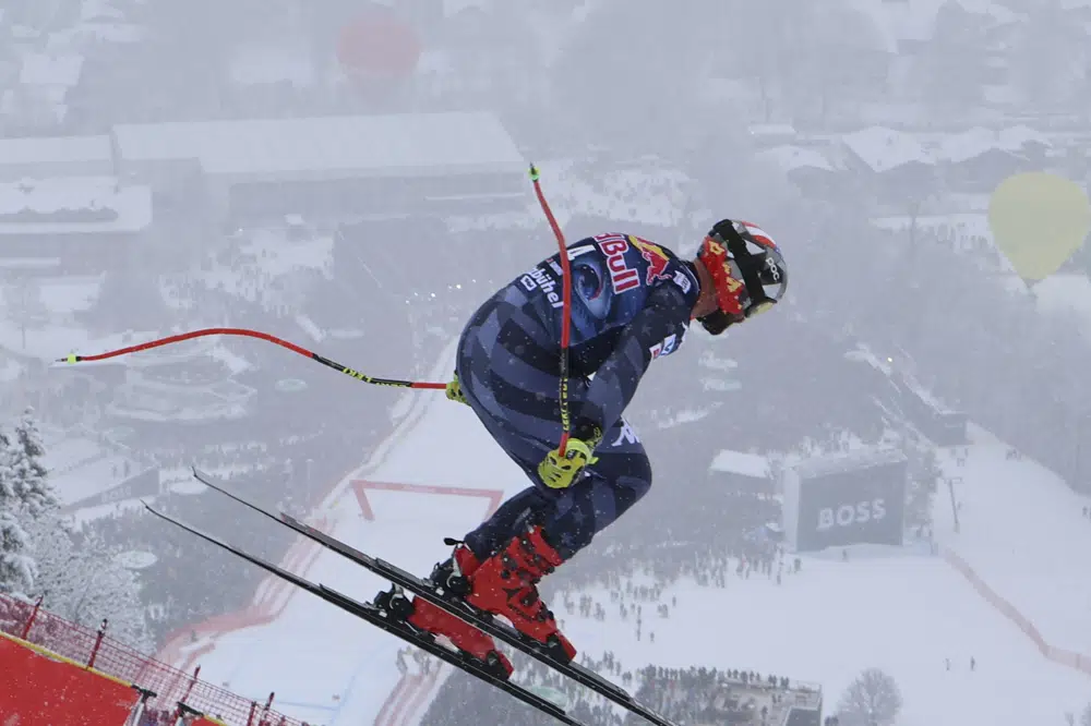 United States' Travis Ganong speeds down the course during an alpine ski, men's World Cup downhill race in Kitzbuehel, Austria, Saturday, Jan. 21, 2023. (AP Photo/Marco Trovati)