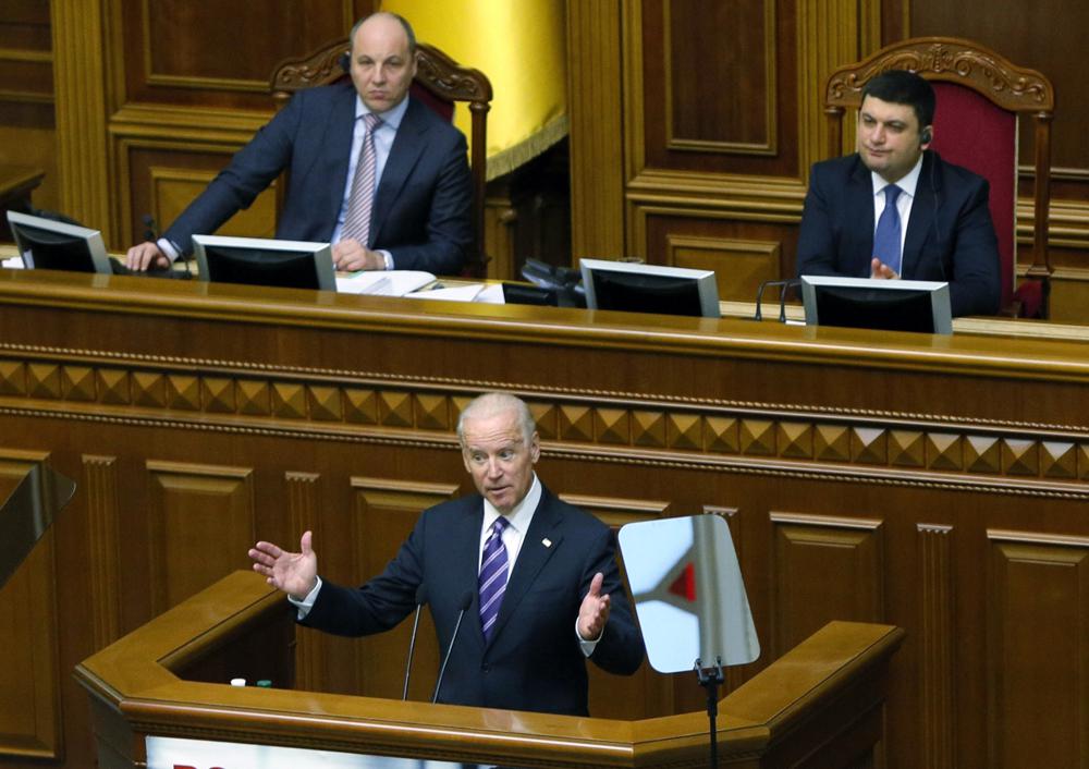 FILE - U.S. Vice President Joe Biden addresses the Ukraine Parliament in Kyiv, Ukraine, Dec. 8, 2015.  The Ukrainian parliament thundered with applause as Joe Biden stepped into the wood-paneled chamber a little more than six years ago. Five hundred miles to the south and east, Russian troops and separatists were occupying parts of the country, and President Barack Obama had dispatched his vice president in a show of solidarity with the besieged nation.(AP Photo/Sergei Chuzavkov, Pool, File)