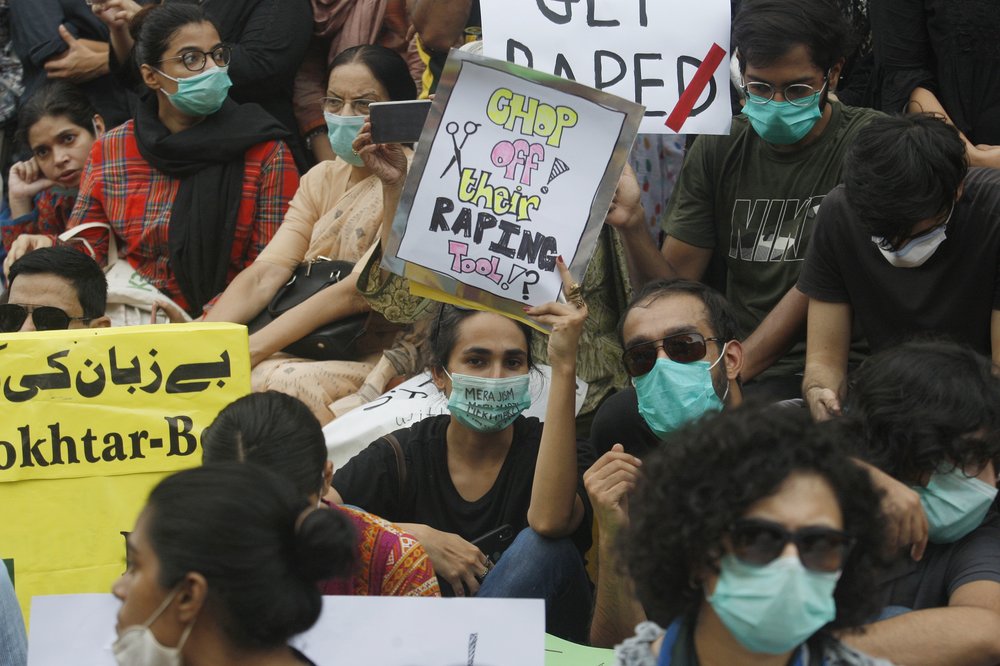 Members of civil society groups take part in a rally to condemn the incident of rape on a deserted highway, in Karachi, Pakistan, Saturday, Sept. 12, 2020. Pakistani police said they detained 15 people for questioning after two armed men allegedly gang raped a woman in front of her children after her car broke down on a deserted highway near the eastern city of Lahore. (AP Photo/Fareed Khan)