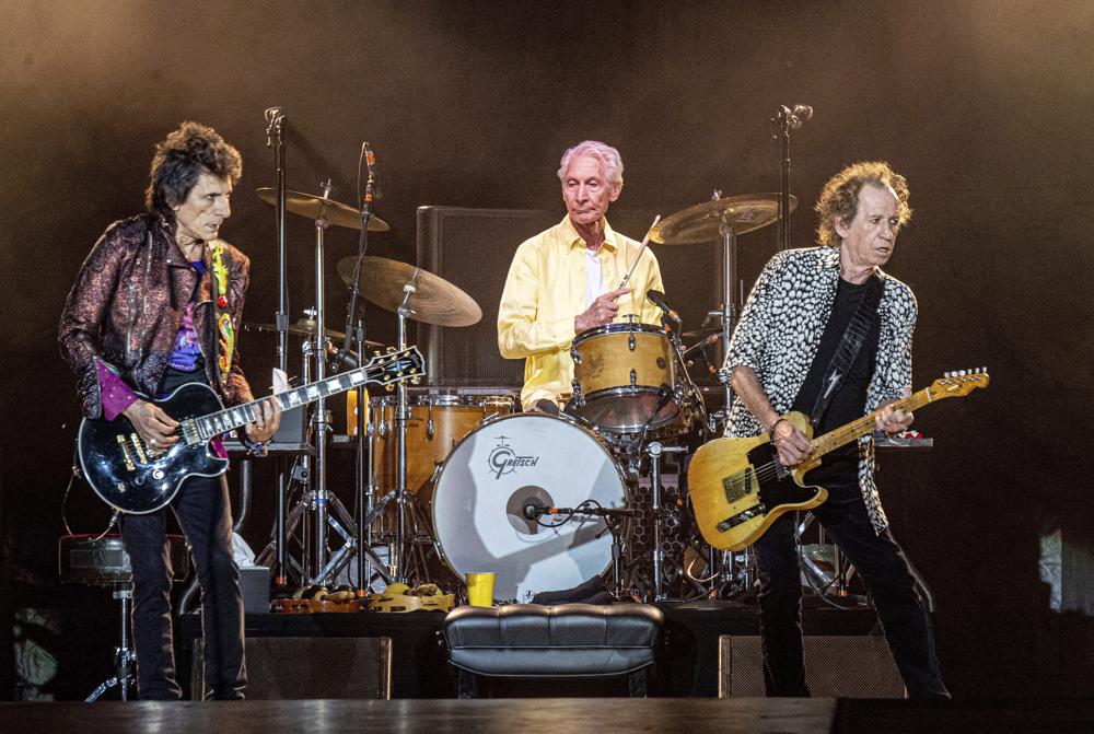 FILE - Ronnie Wood, from left, Charlie Watts and Keith Richards of The Rolling Stones perform on  July 15, 2019, in New Orleans. Watts' publicist, Bernard Doherty, said Watts passed away peacefully in a London hospital surrounded by his family on Tuesday, Aug. 24, 2021. He was 80.  (Photo by Amy Harris/Invision/AP, File)