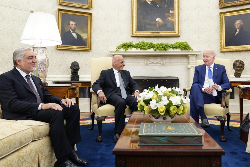 President Joe Biden meets with Afghan President Ashraf Ghani and Chairman of the High Council for National Reconciliation Abdullah Abdullah, left, in the Oval Office of the White House in Washington, Friday, June 25, 2021. (AP Photo/Susan Walsh)