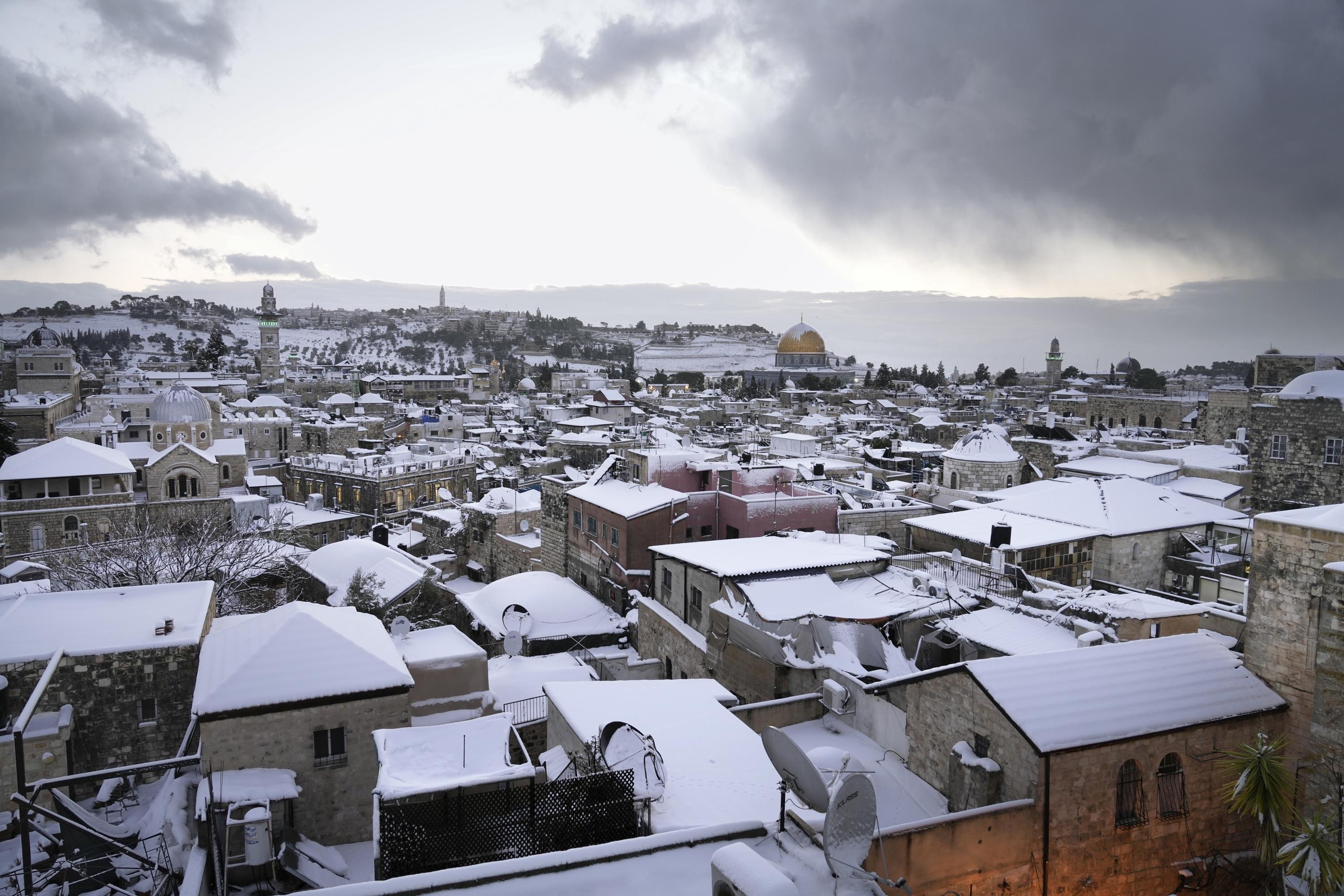 Jerusalem blanketed in white after rare snowfall | AP News