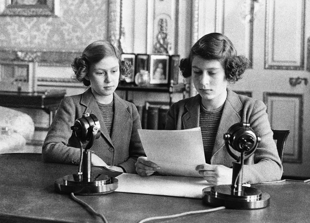 FILE - In this Oct. 13, 1940 file photo, Britain's Princess Elizabeth, right and Princess Margaret make their first radio broadcast, in London. Queen Elizabeth II, Britain’s longest-reigning monarch and a symbol of stability across much of a turbulent century, has died on Thursday, Sept, 8, 2022. She was 96. (AP Photo, File)
