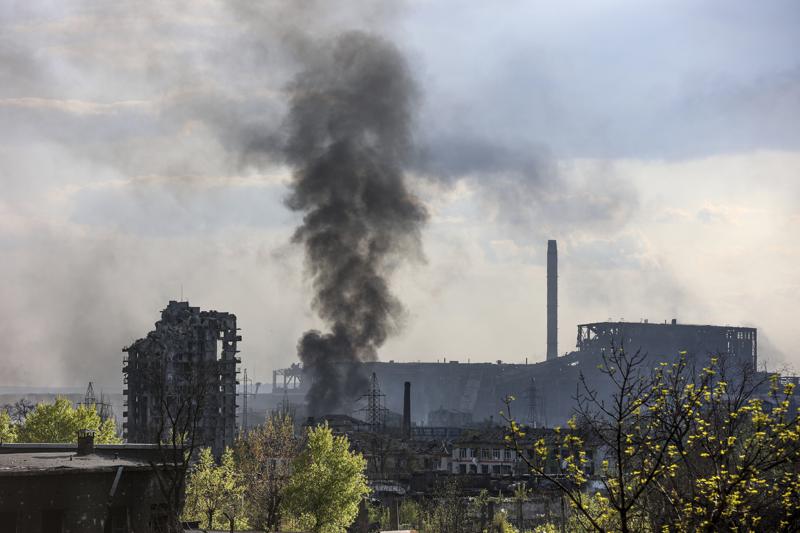 Smoke rises from the Metallurgical Combine Azovstal in Mariupol, in territory under the government of the Donetsk People's Republic, eastern Ukraine, Wednesday, May 4, 2022. (AP Photo/Alexei Alexandrov)