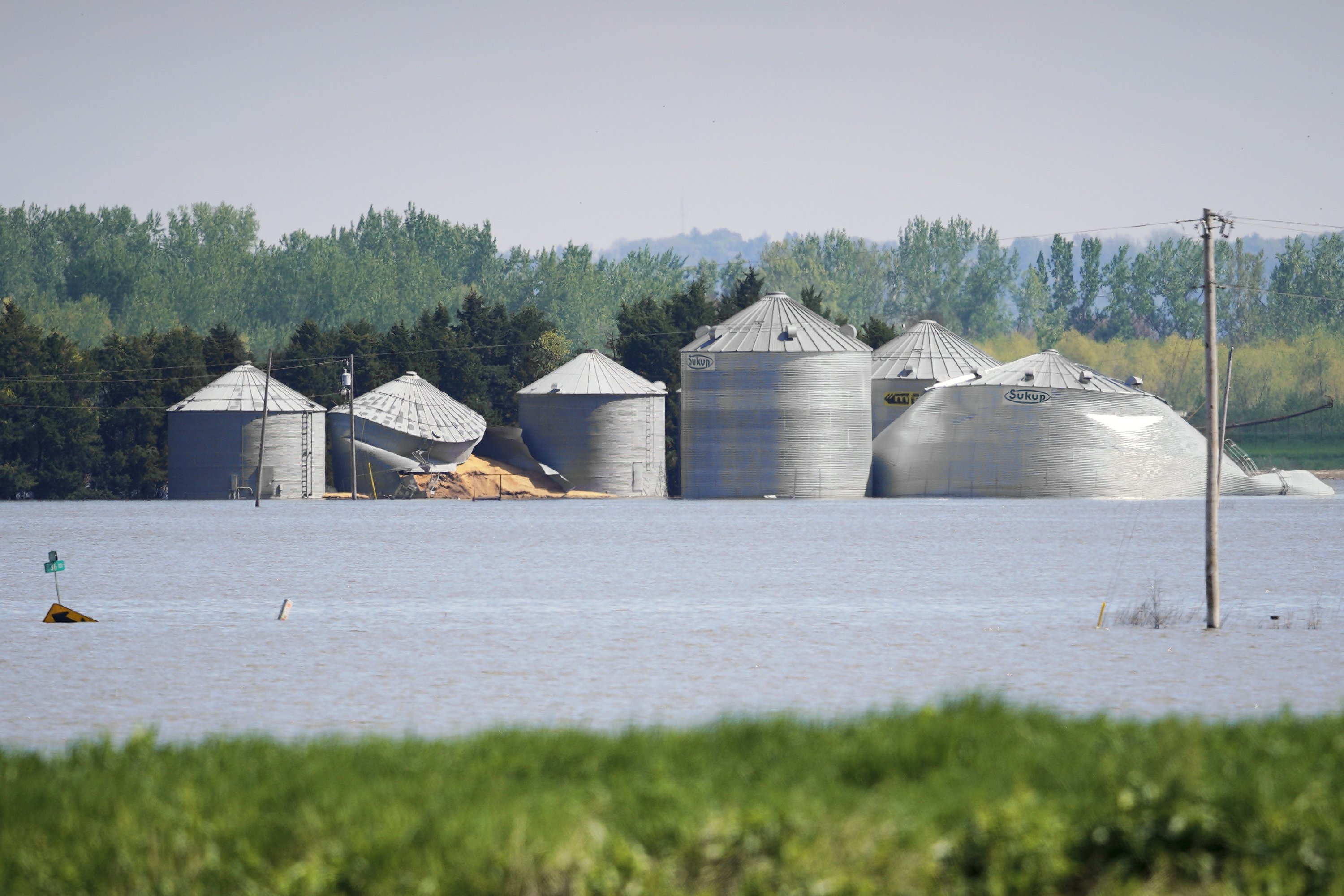 Flooded farmers face growing dilemma in warming world - The Associated Press