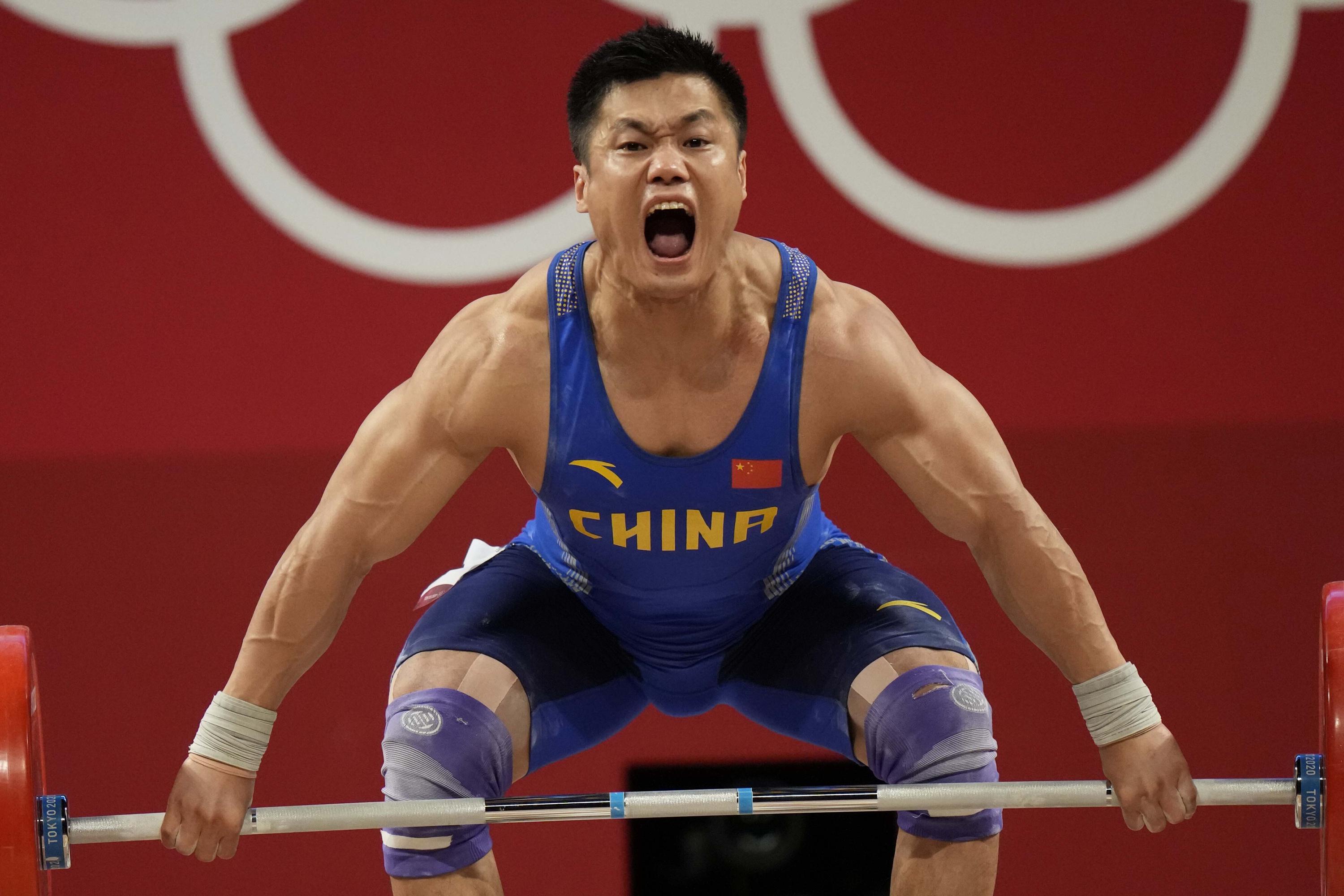 Lyu Xiaojun oldest Olympic weightlifting at 37 | AP News