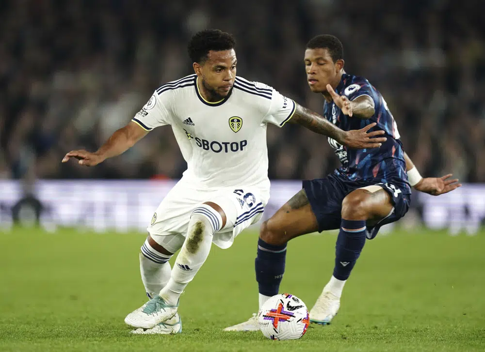 Leeds United's Weston McKennie, left, and Nottingham Forest's Danilo battle for the ball during the English Premier League soccer match between Leeds United and Nottingham Forest at Elland Road, Leeds, England, Tuesday, April 4, 2023. (David Davies/PA via AP)