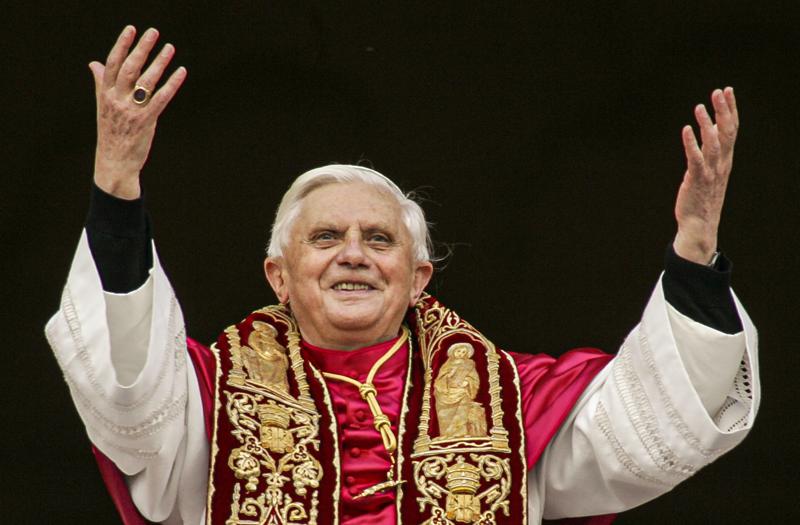 FILE - Pope Benedict XVI greets the crowd from the central balcony of St. Peter's Basilica at the Vatican on April 19, 2005, soon after his election. Pope Emeritus Benedict XVI, the German theologian who will be remembered as the first pope in 600 years to resign, has died, the Vatican announced Saturday. He was 95. (AP Photo/Andrew Medichini, File)