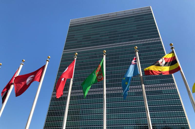 FILE - Flags fly outside the United Nations headquarters during the 74th session of the United Nations General Assembly on Sept. 28, 2019. Victor Madrigal-Borloz, the independent U.N. expert on sexual orientation and gender identity, said Tuesday, Aug. 30, 2022, that enormous progress has been achieved in the last 50 years for lesbian, gay, bisexual and transgender people in the United States but unfortunately “equality is not yet within reach and in many cases not within sight” for LGBT communities. (AP Photo/Jennifer Peltz, File)
