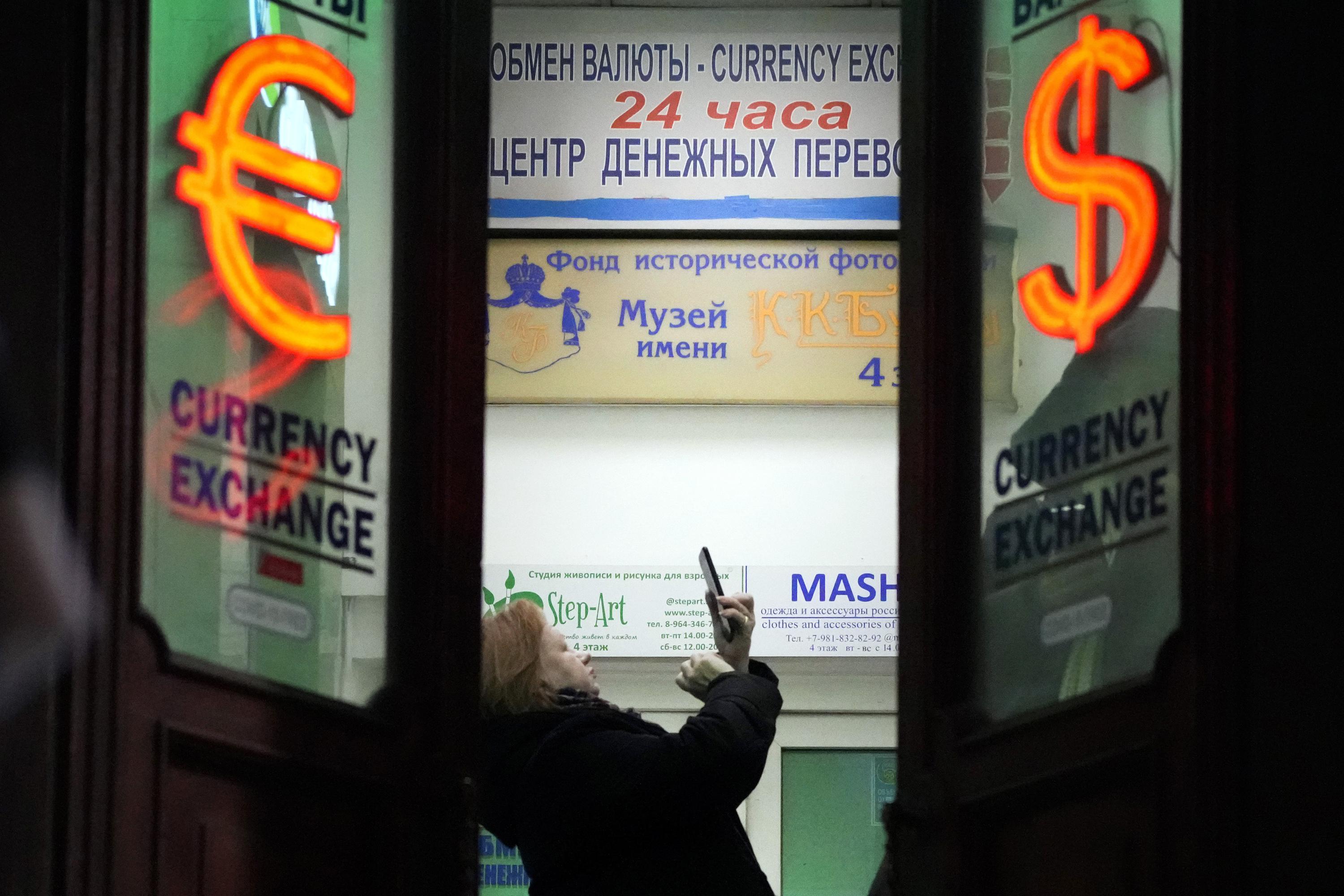 Russian stock market, crushed by war, opens with limits AP News