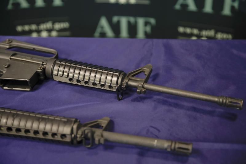 FILE - Homemade rifles are displayed on a table at an ATF field office in Glendale, Calif., on Aug. 29, 2017. Gov Gavin Newsom signed a bill by Assemblyman Phil Ting, D-San Francisco, Tuesday, June 12, 2022, that creates a good conduct code for gun makers and dealers and allows anyone who suffers harm from violations to sue. (AP Photo/Jae C. Hong, File)