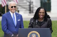 FILE - President Joe Biden listens as Judge Ketanji Brown Jackson speaks during an event on the South Lawn of the White House in Washington, April 8, 2022, celebrating the confirmation of Jackson as the first Black woman to reach the Supreme Court. Overall, 48% of Americans say they approve and 19% disapprove of Jackson’s confirmation to the high court according to the new poll from The Associated Press-NORC Center for Public Affairs Research. The remaining 32% of Americans hold no opinion. (AP Photo/Andrew Harnik, File)