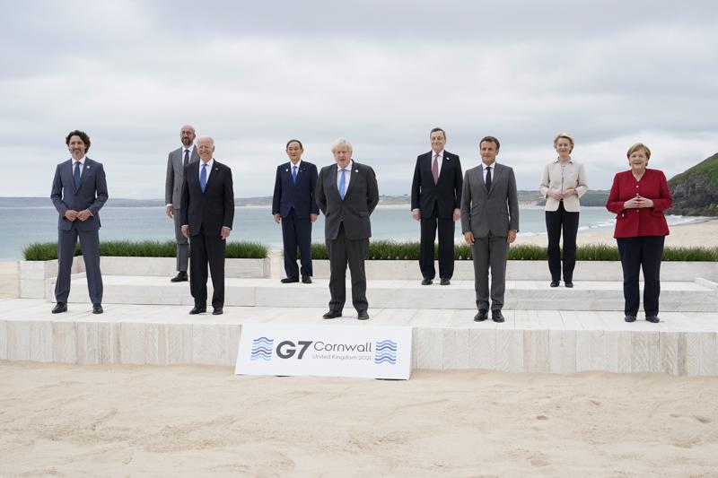 Leaders of the G7 pose for a group photo on overlooking the beach at the Carbis Bay Hotel in Carbis Bay, St. Ives, Cornwall, England, Friday, June 11, 2021. Leaders from left, Canadian Prime Minister Justin Trudeau, European Council President Charles Michel, U.S. President Joe Biden, Japan's Prime Minister Yoshihide Suga, British Prime Minister Boris Johnson, Italy's Prime Minister Mario Draghi, French President Emmanuel Macron, European Commission President Ursula von der Leyen and German Chancellor Angela Merkel. (AP Photo/Patrick Semansky, Pool)