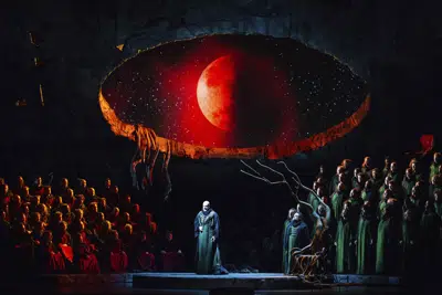This image released by the Metropolitan Opera shows Bass Günther Groissböck, center, performing as Telramund during a dress rehearsal of director François Girard's production of Wagner's "Lohengrin" at the Metropolitan Opera on Feb. 18, 2023. (Marty Sohl/Metropolitan Opera via AP)