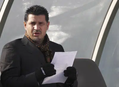 FILE - Former Iran's national soccer team coach Ali Daei before an Asian Cup 2011 qualifying soccer match between Iran and Singapore in Tehran, Iran, Jan, 14, 2009. Daei has expressed support for anti-government protests, saying that his wife and daughter were prevented from leaving the country on Monday, Dec. 26, 2022, after their plane made an unannounced stopover en route to Dubai. (AP Photo/Hasan Sarbakhshian, File)