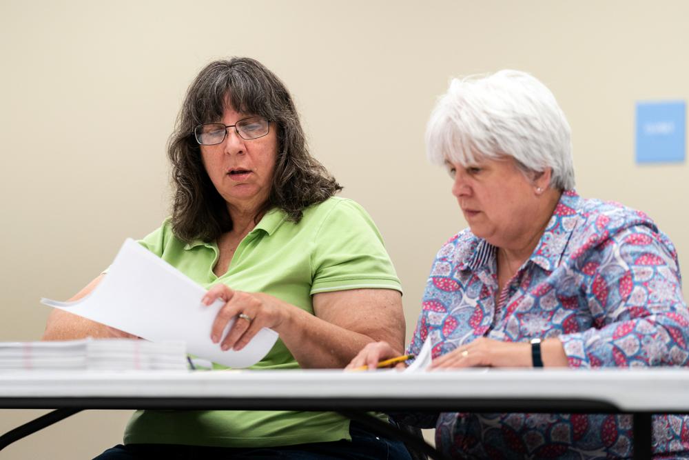 Election workers perform a recount of ballots from the recent primary election at the Montour County administration center in Danville, Pa., Friday, May 27, 2022. (AP Photo/Matt Rourke)