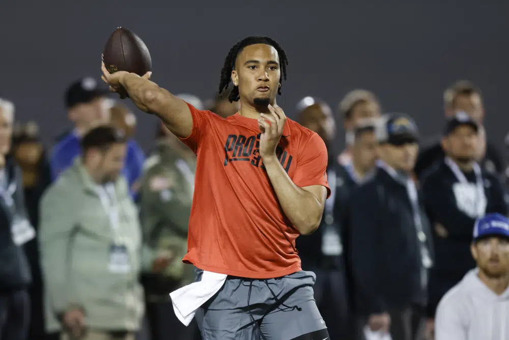 Ohio State football quarterback C.J. Stroud runs a drill at the school's NFL Pro Day in Columbus, Ohio, Wednesday, March 22, 2023. (AP Photo/Paul Vernon)