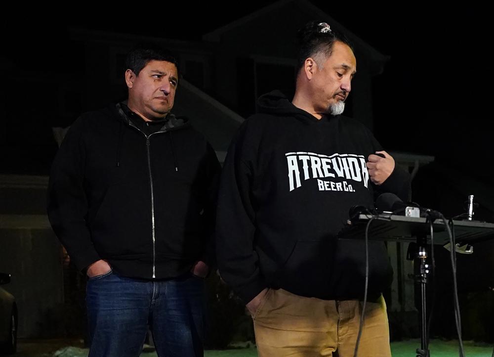 Richard Fierro, right, talks with his brother Ed Fierro about his efforts to subdue the gunman in Saturday's fatal shooting at Club Q, during a news conference Monday, Nov. 21, 2022, outside his home in in Colorado Springs, Colo.  (AP Photo/Jack Dempsey)