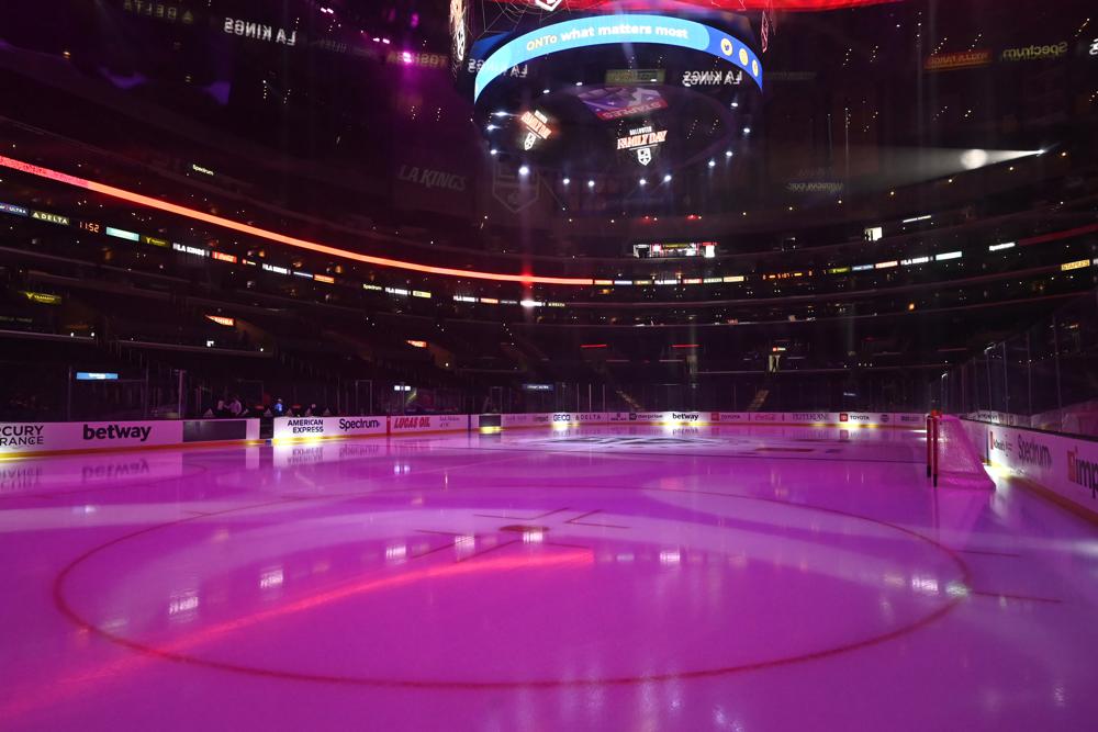 The ice at Staples Center is illuminated before an NHL hockey game between the Los Angeles Kings and the Buffalo Sabres, Sunday, Oct. 31, 2021, in Los Angeles. (AP Photo/Jayne Kamin-Oncea)