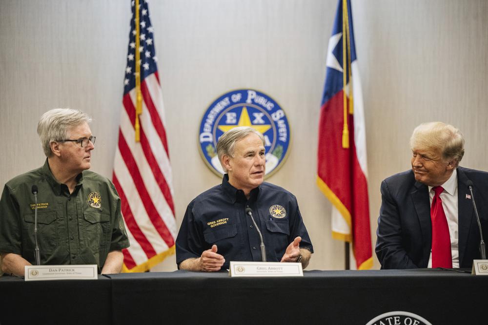 Texas Lt. Gov. Dan Patrick, left, Texas Gov. Greg Abbott, center, and former President Donald Trump attend a border security briefing to discuss further plans in securing the southern border wall on Wednesday, June 30, 2021, in Weslaco, Texas. (Brandon Bell/Pool via AP)