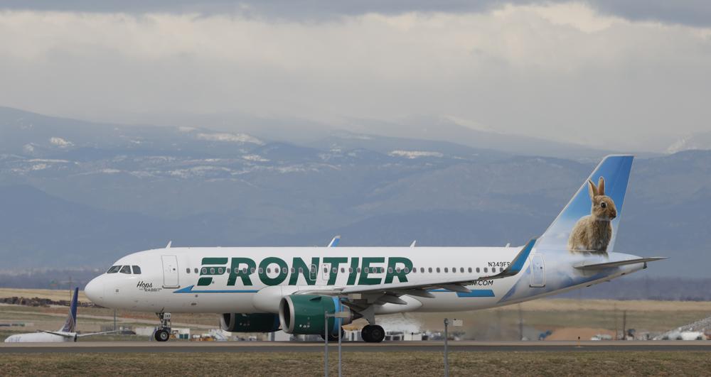 FILE - A Frontier Airlines jetliner taxis to a runway to take off from Denver International Airport Thursday, April 23, 2020, in Denver. Frontier Airlines' parent company is buying Spirit Airlines in a $2.9 billion cash-and-stock deal that will allow the combined airline to be more competitive against its larger rivals. (AP Photo/David Zalubowski, File)