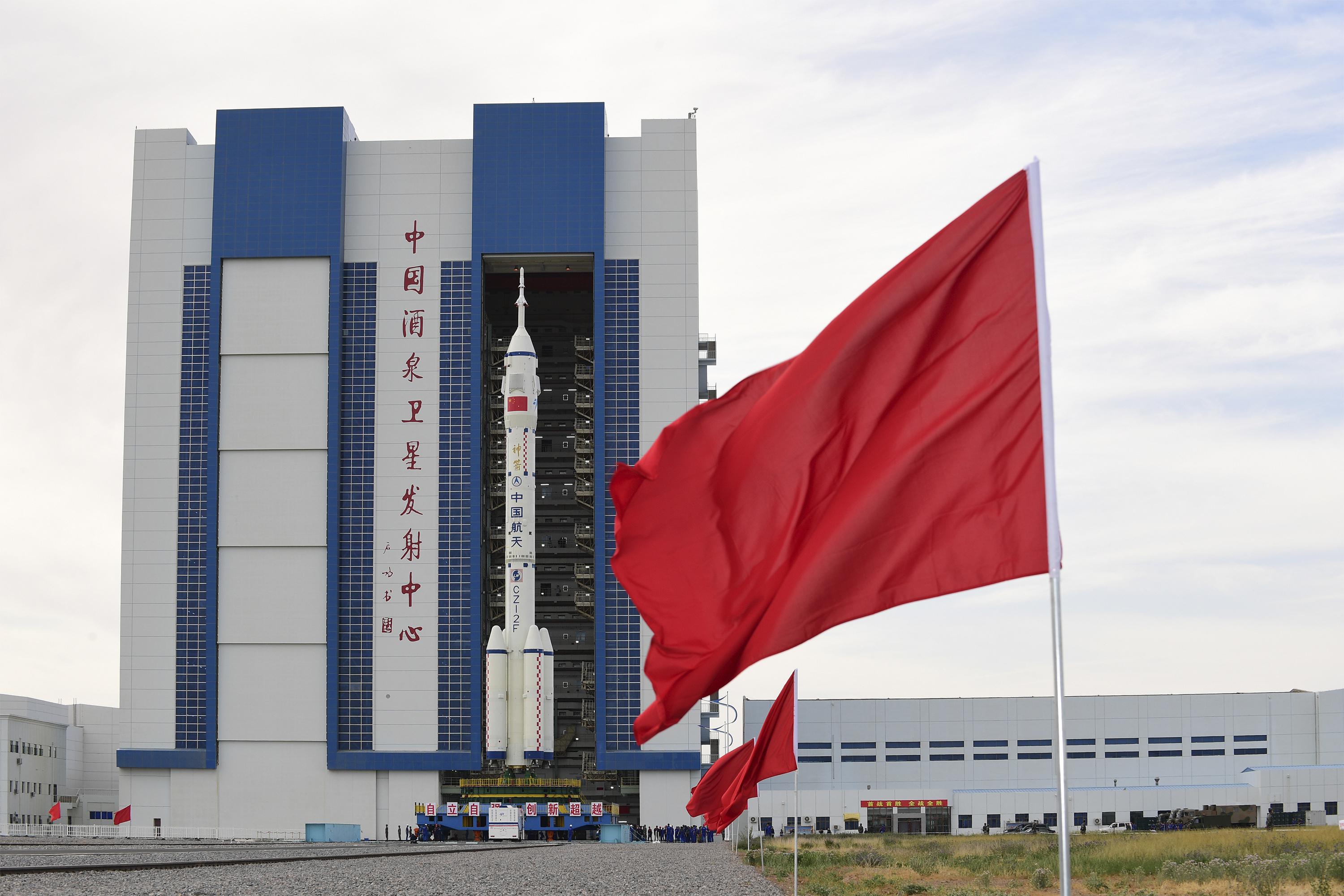 Rocket on pad, China ready to send 1st crew to space station - Associated Press