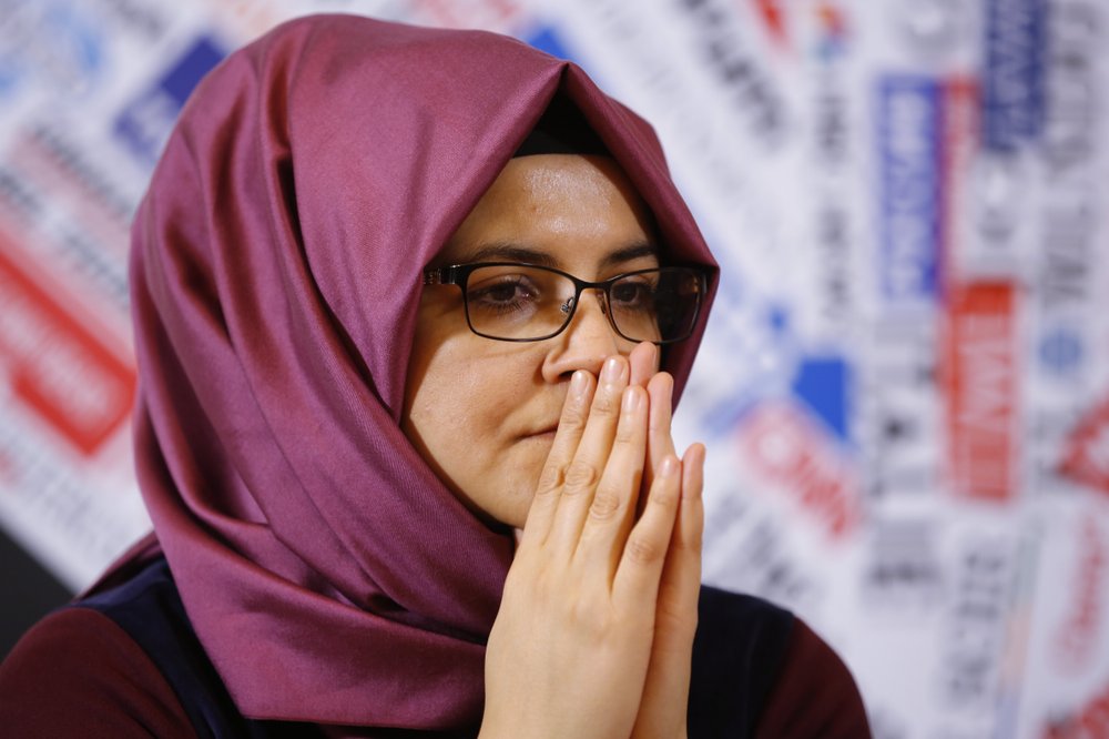 FILE - IN this Dec. 17, 2019 file photo, Hatice Cengiz, fiancee of late journalist Jamal Khashoggi who was kidnapped and killed during a visit to the Arabian consulate in Istanbul on Oct. 2018, gestures during a press conference at the Foreign Press Association in Rome.  (AP Photo/Domenico Stinellis, File)